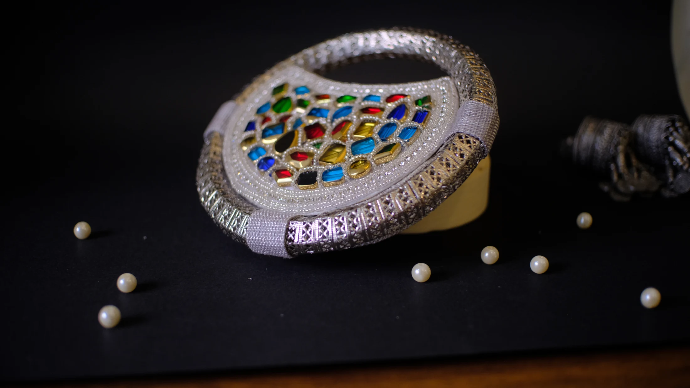 The Sitara, Silver & colour · Round clutch